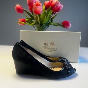Coach black wedge style A3255. Worn once. Still have box.